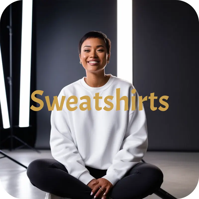 Woman wearing plain white oversized sweatshirt sitting cross-legged in studio – Spiritual Hustle Wear collection